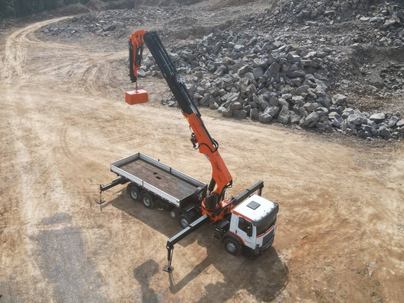 TKA truck-mounted crane performing a field lift